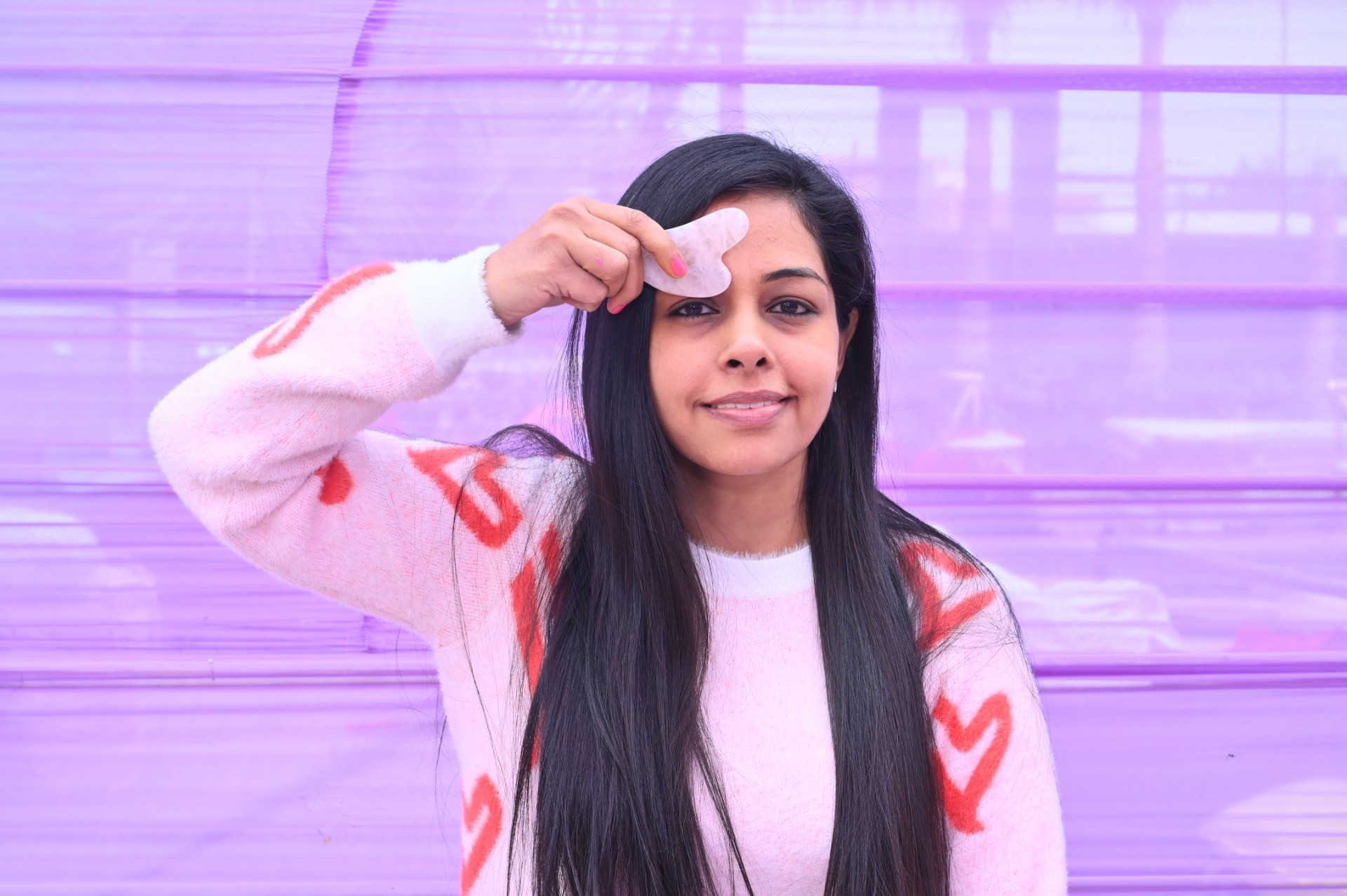 Surbhi — certified face yoga coach, eyes closed in soft natural light